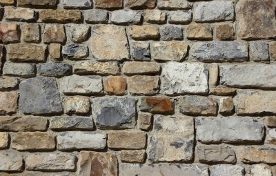 stones-wall-background-quarry-stone-36459 Detailed image of a textured stone wall, showcasing various shades and shapes.